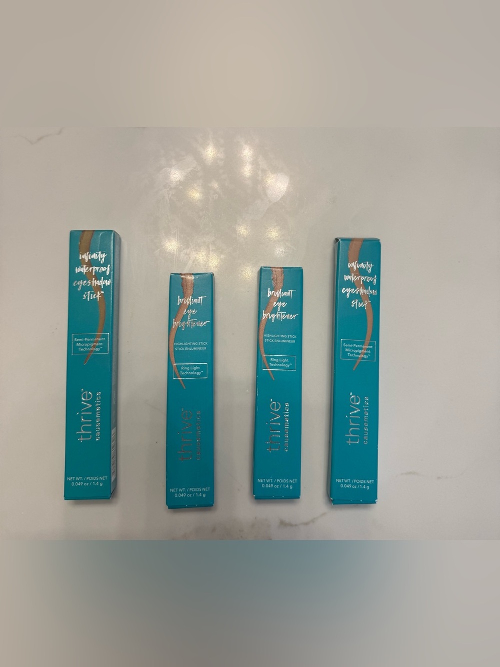 thrive causemetics, NWTs 4 new in box 2 eye Brightener & 2 waterproof eyeshadow